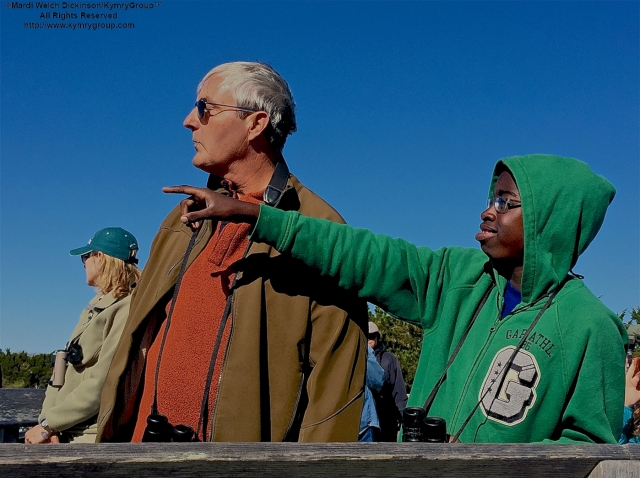 L. To R. Pete Dunne; Kojo Baidoo, Points out a Hawk to Pete Dunne while birdwatching at the Famous Cape May Point Hawk Watch Platform, Cape May Point State Park, NJ. ©Mardi Welch Dickinson. All Rights Reserved.