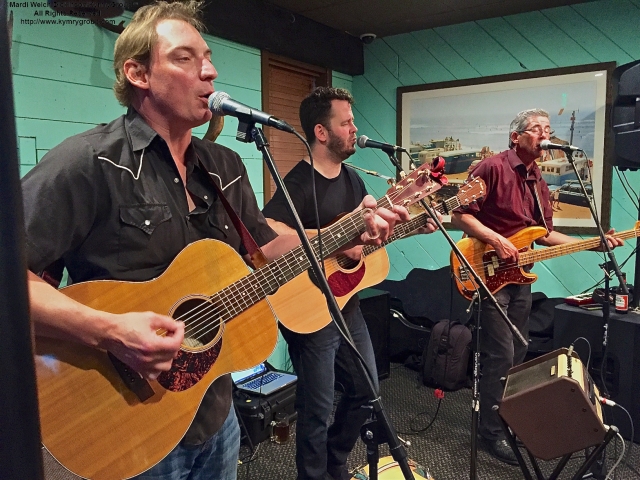 L.toR. Rudy Dauth, Wylie Shipman, Peter Riley of The Woedoggies, performing at the Rusty Nail for CMBO's Cape May Fall Birding Festival Kickoff Party, Cape May NJ. ©Mardi Welch Dickinson. All Rights Reserved.